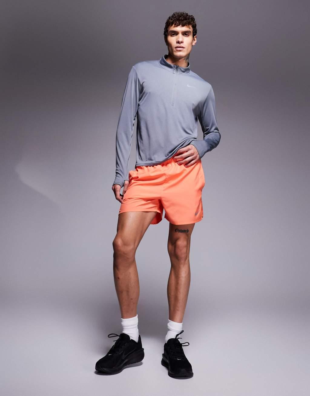 Nike Running Challenger Dri-FIT 5 inch shorts in orange Product Image