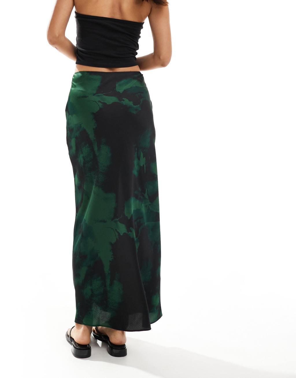 ASOS DESIGN satin bias cut midi skirt in green & black blurred floral Product Image