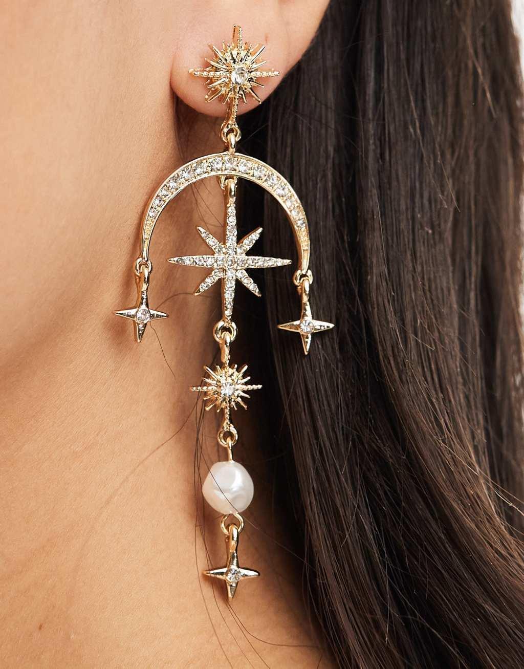 ASOS DESIGN drop earrings with celestial crystal and faux pearl detail in gold tone Product Image