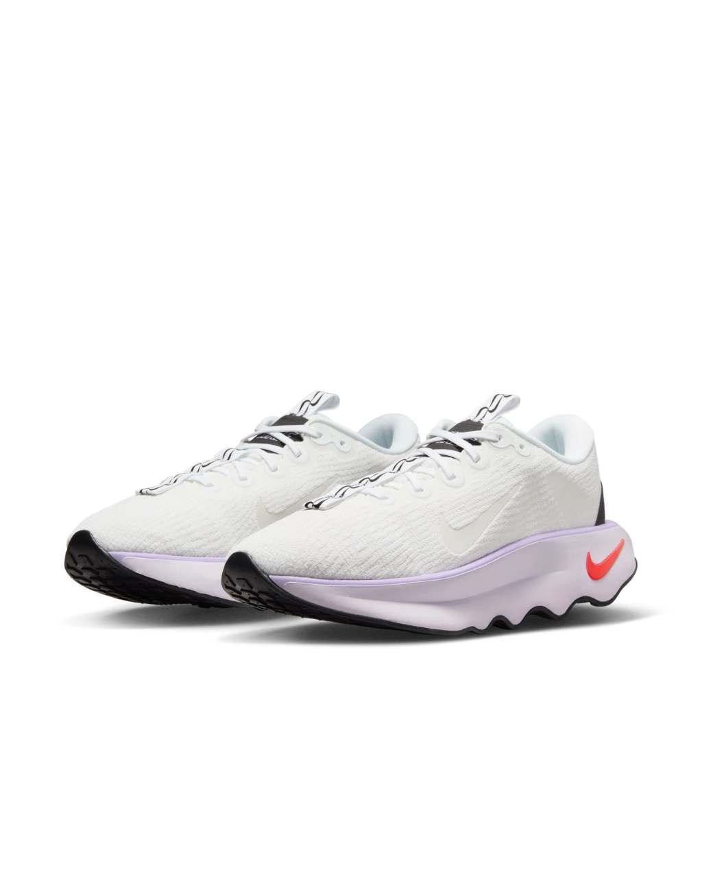 Nike Training Motiva sneakers in white and pink Product Image