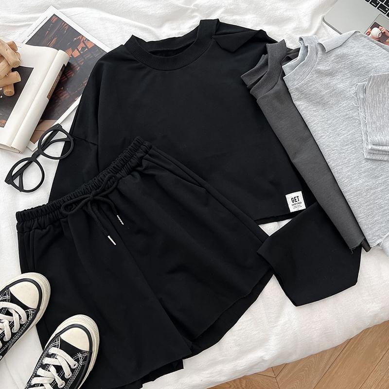 Set: Long-Sleeve Crew Neck Plain Crop T-Shirt + Drawstring Plain Shorts Product Image