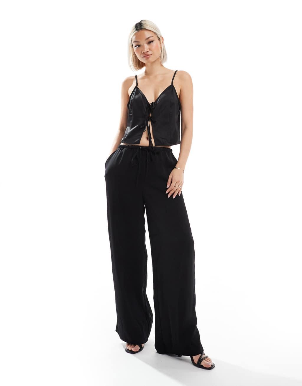 ASOS DESIGN satin cami top with tie front in black Product Image