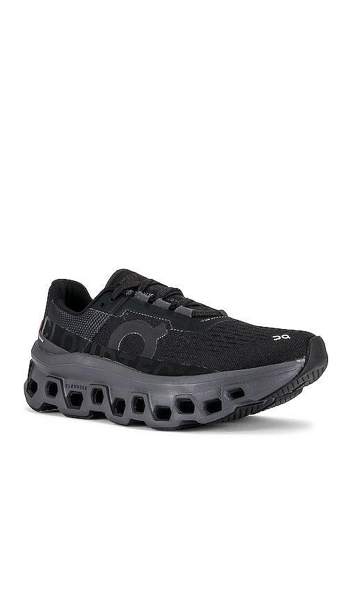 On Cloudmonster Sneaker in Black. Size 10, 5, 5.5, 6.5, 7.5, 8, 8.5, 9, 9.5. Product Image