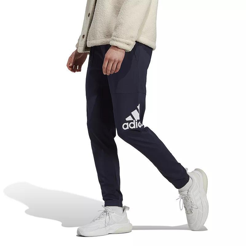 Mens adidas Essentials Badge of Sport Jersey Tapered Pants Dark Blue Product Image