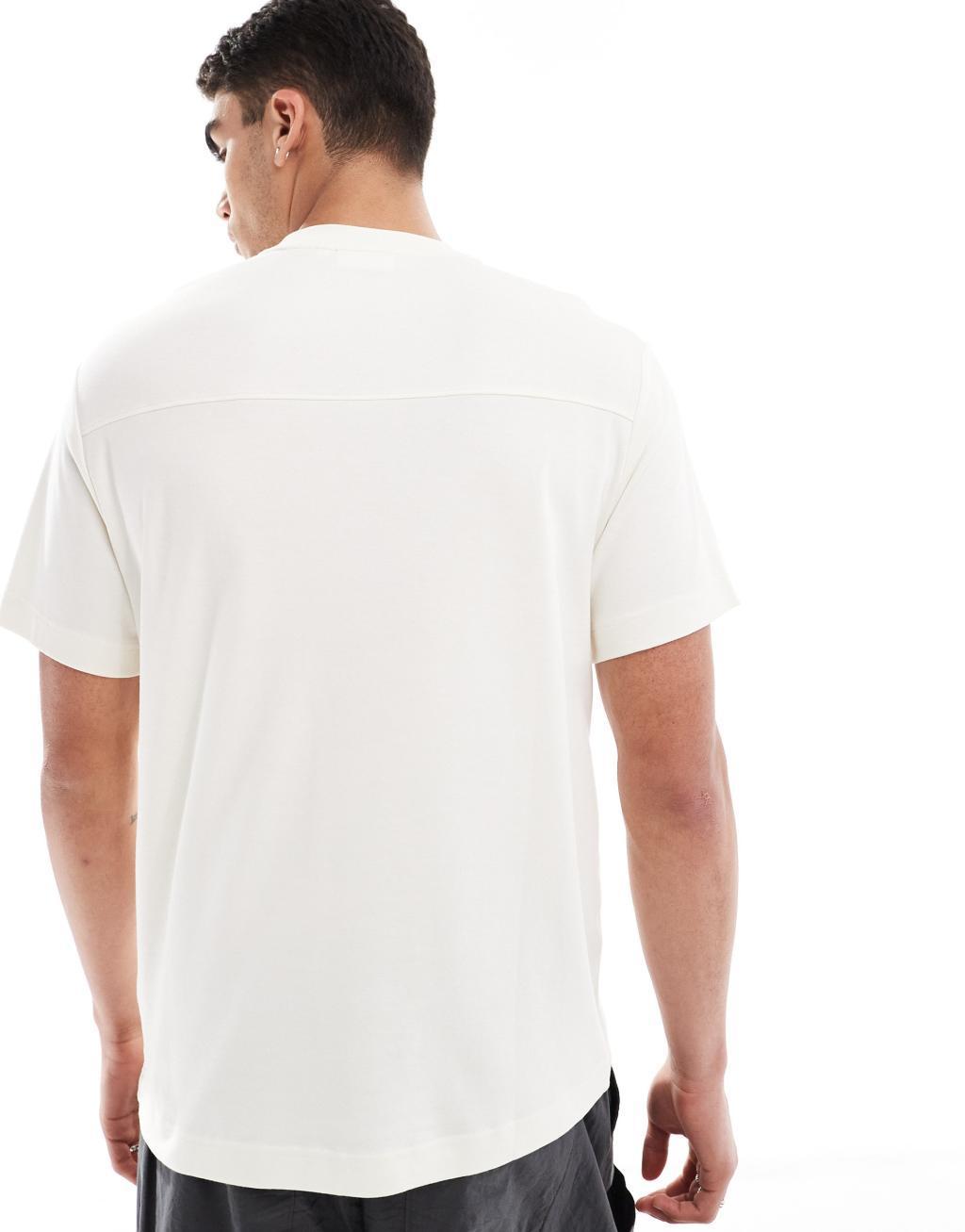 Calvin Klein shadow embossed logo t-shirt in white Product Image