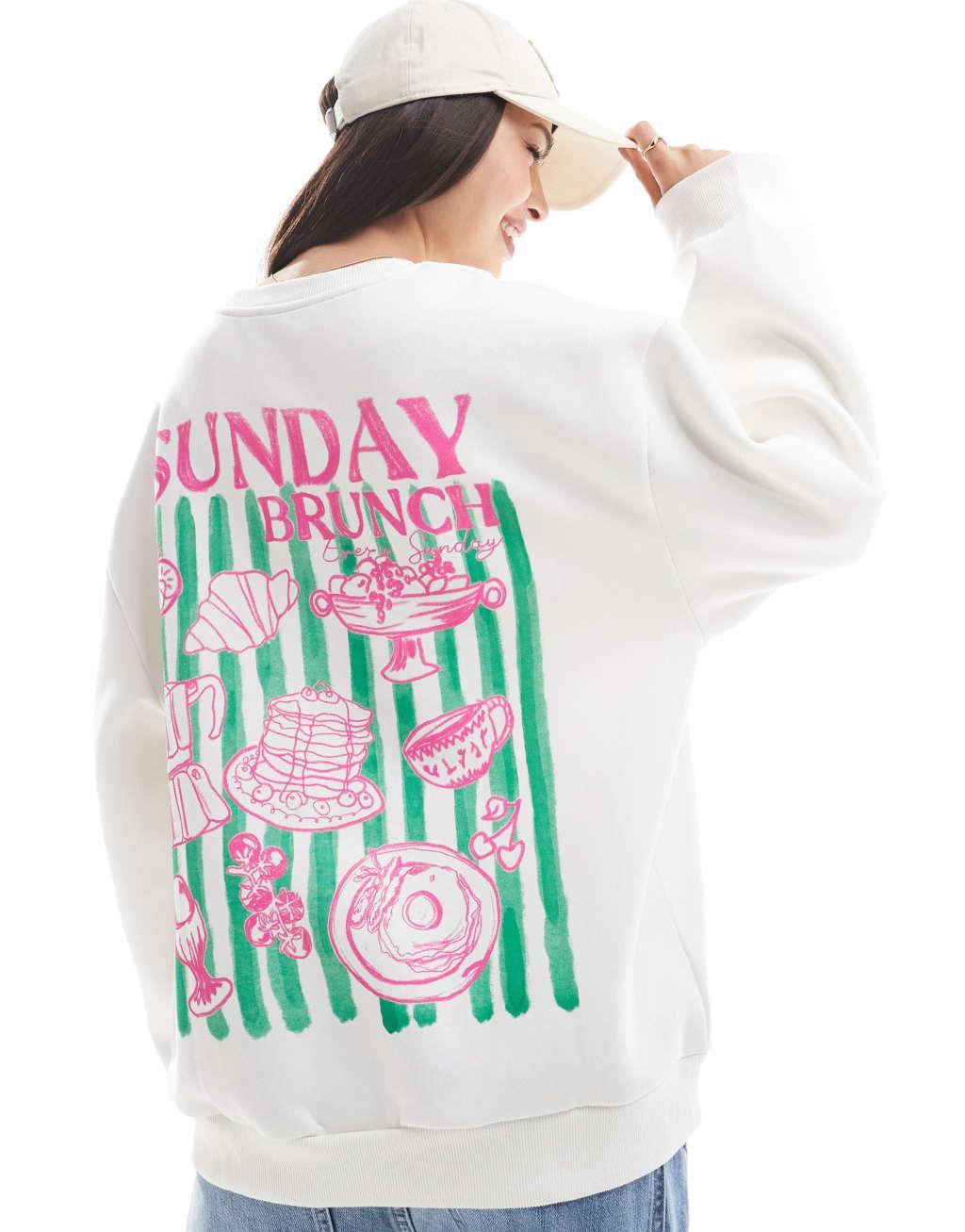 ASOS DESIGN sweatshirt with sunday brunch graphic in coconut milk Product Image