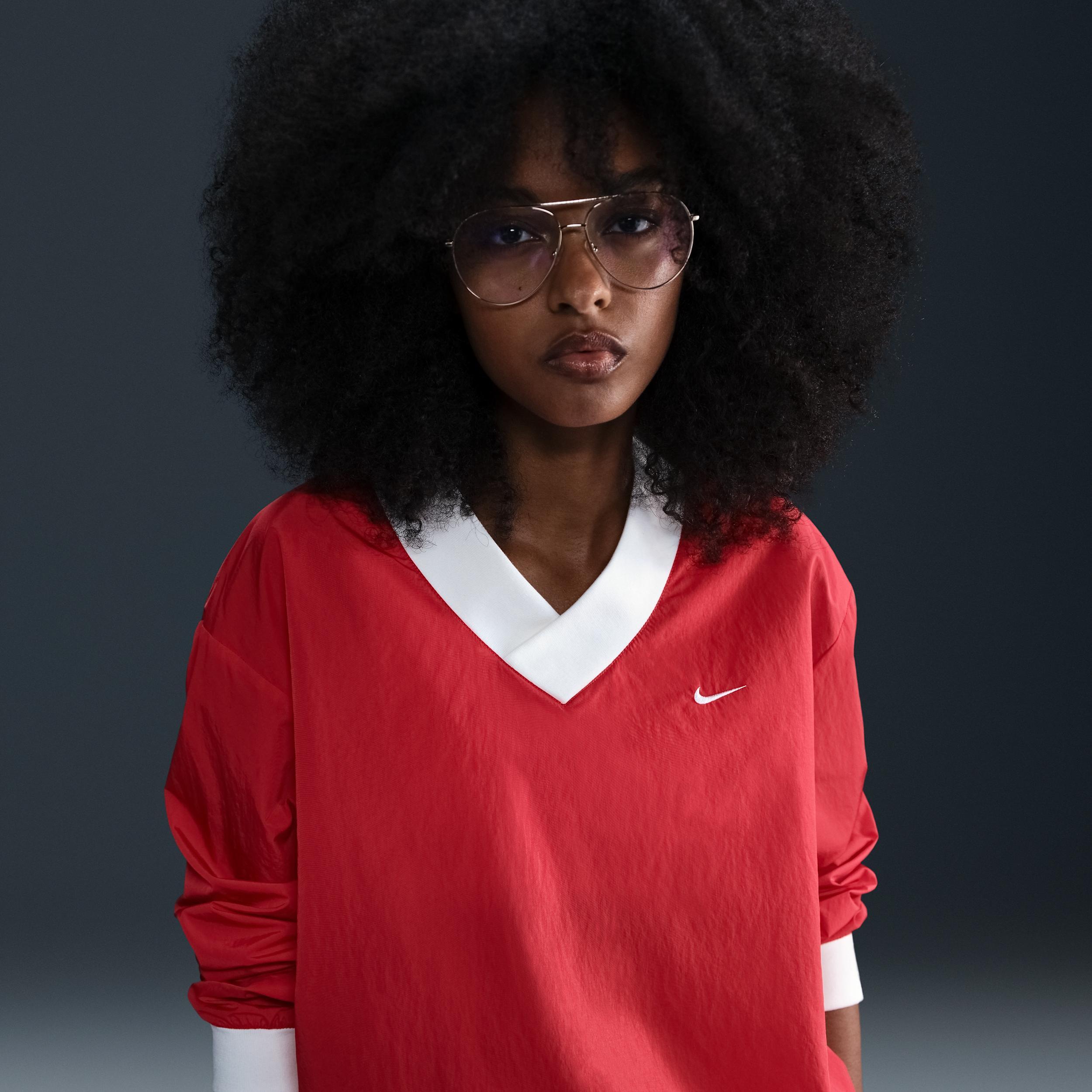 Women's Nike Sportswear Essential Loose UV Woven Long-Sleeve V-Neck Top Product Image