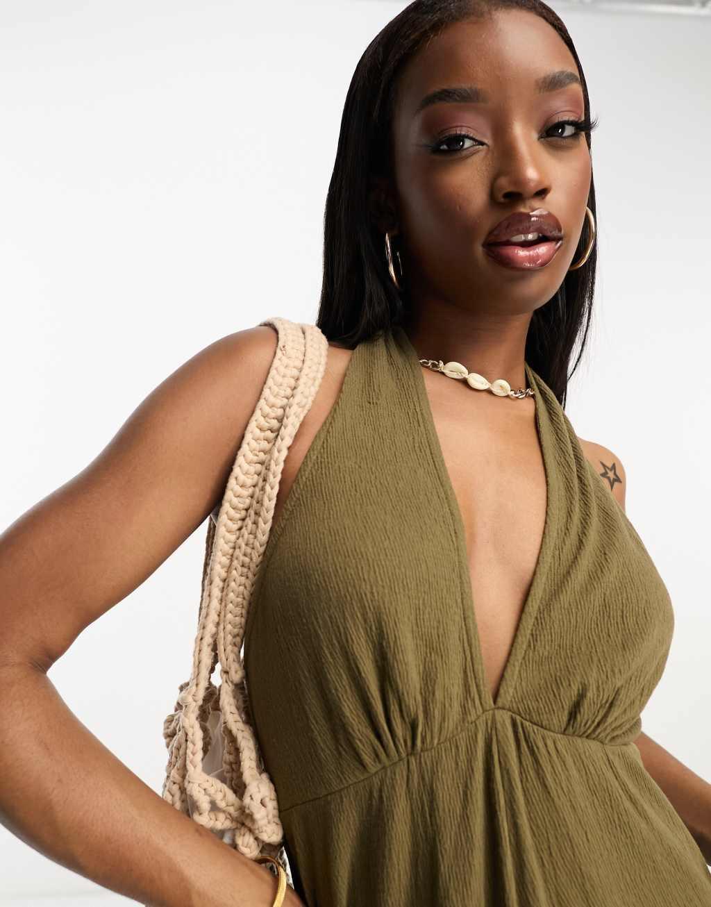 ASOS DESIGN crinkle jersey halter jumpsuit in olive Product Image