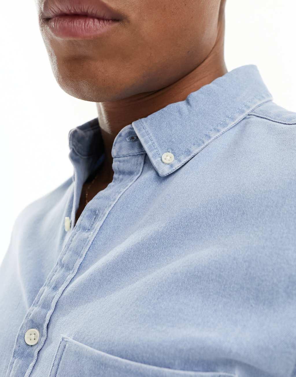 ASOS DESIGN slim roll sleeve denim shirt with button down collar Product Image