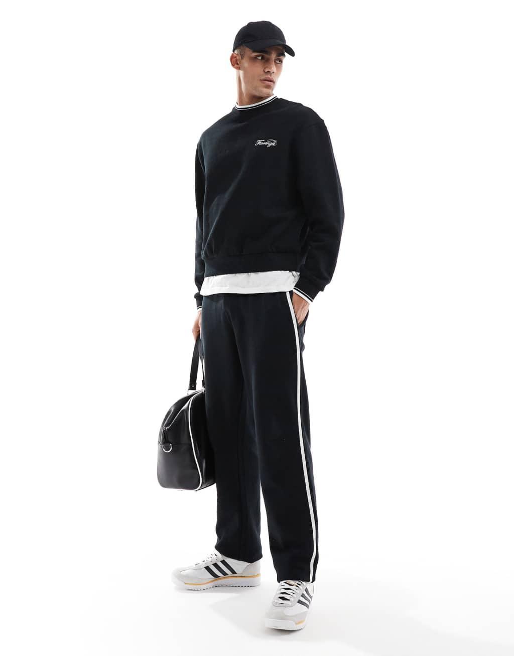 ASOS DESIGN straight leg sweatpants with textured side stripes in black Product Image