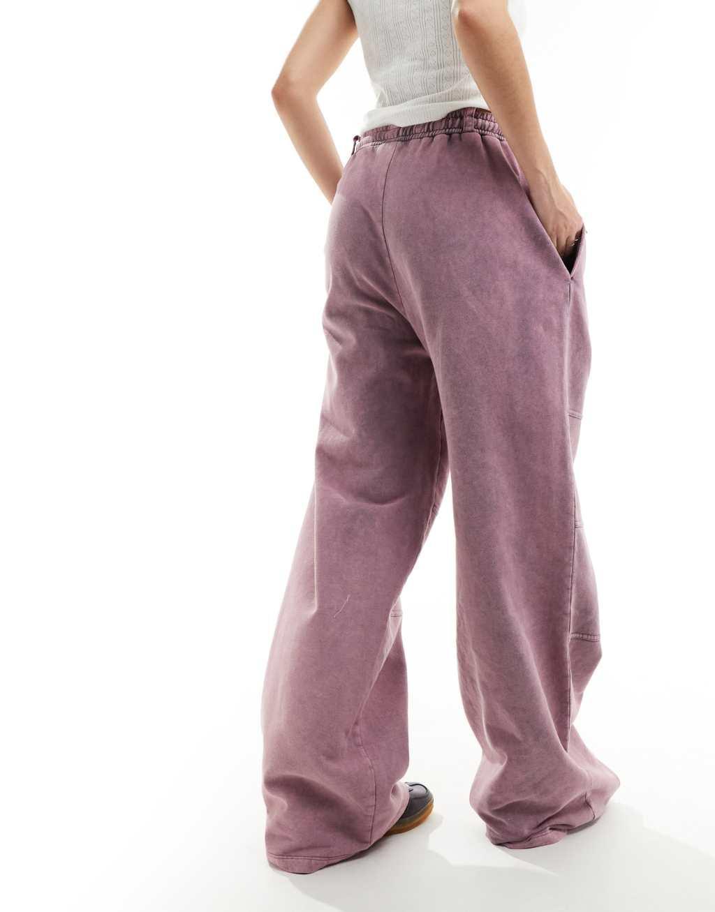 ASOS DESIGN straight leg sweatpants with seam details in pink acid wash Product Image