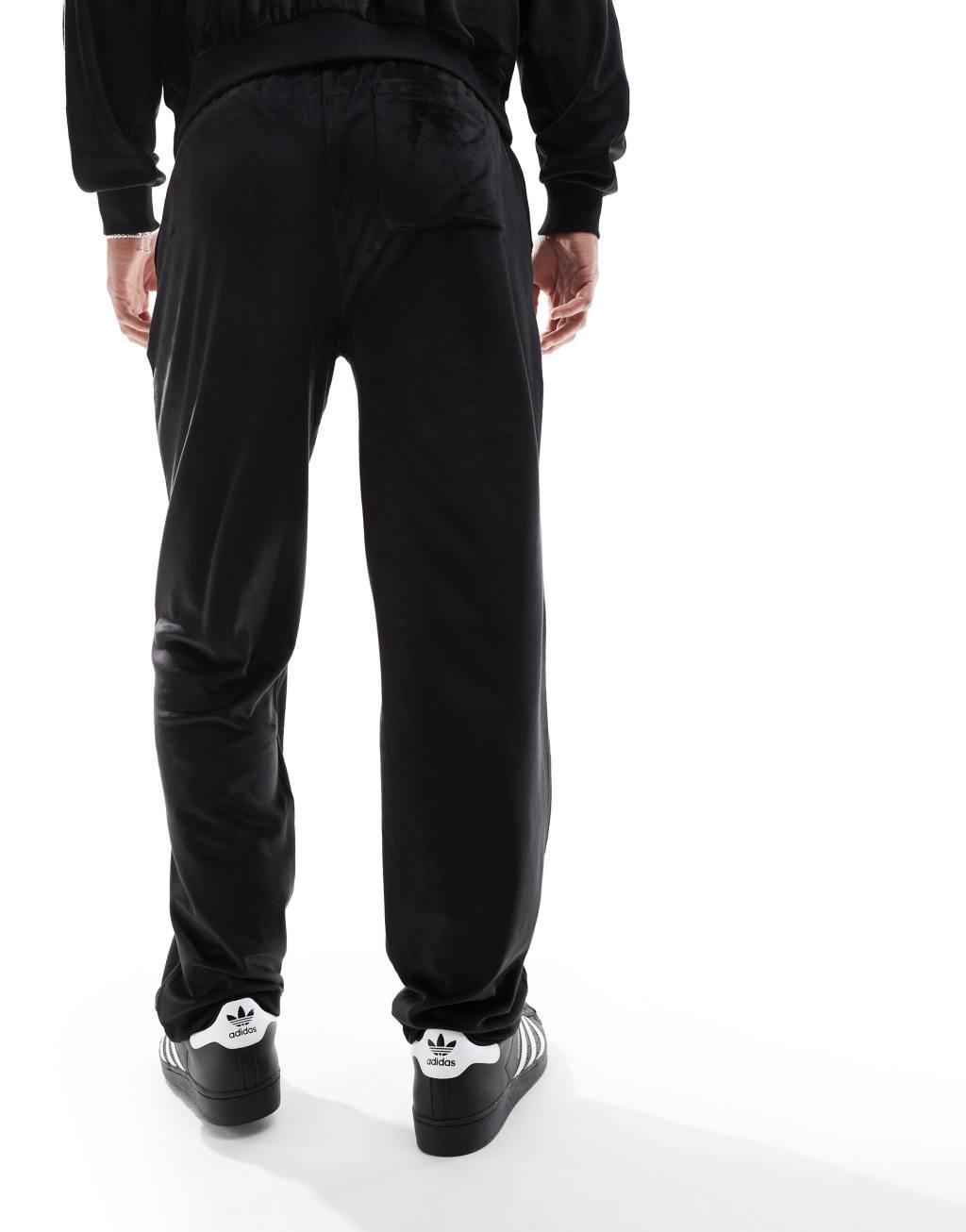 ASOS DESIGN straight leg velour sweatpants in black Product Image