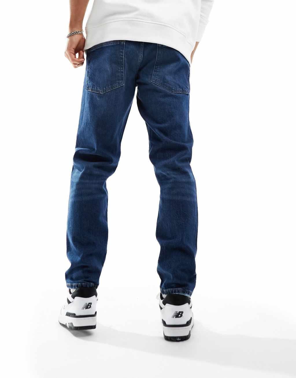 ASOS DESIGN stretch tapered jeans in vintage dark wash Product Image