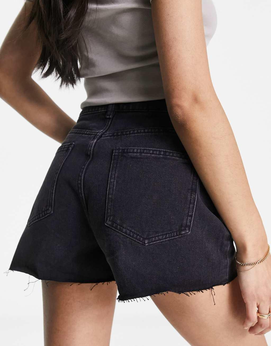 Urban Revivo high rise denim shorts with raw hem in black Product Image