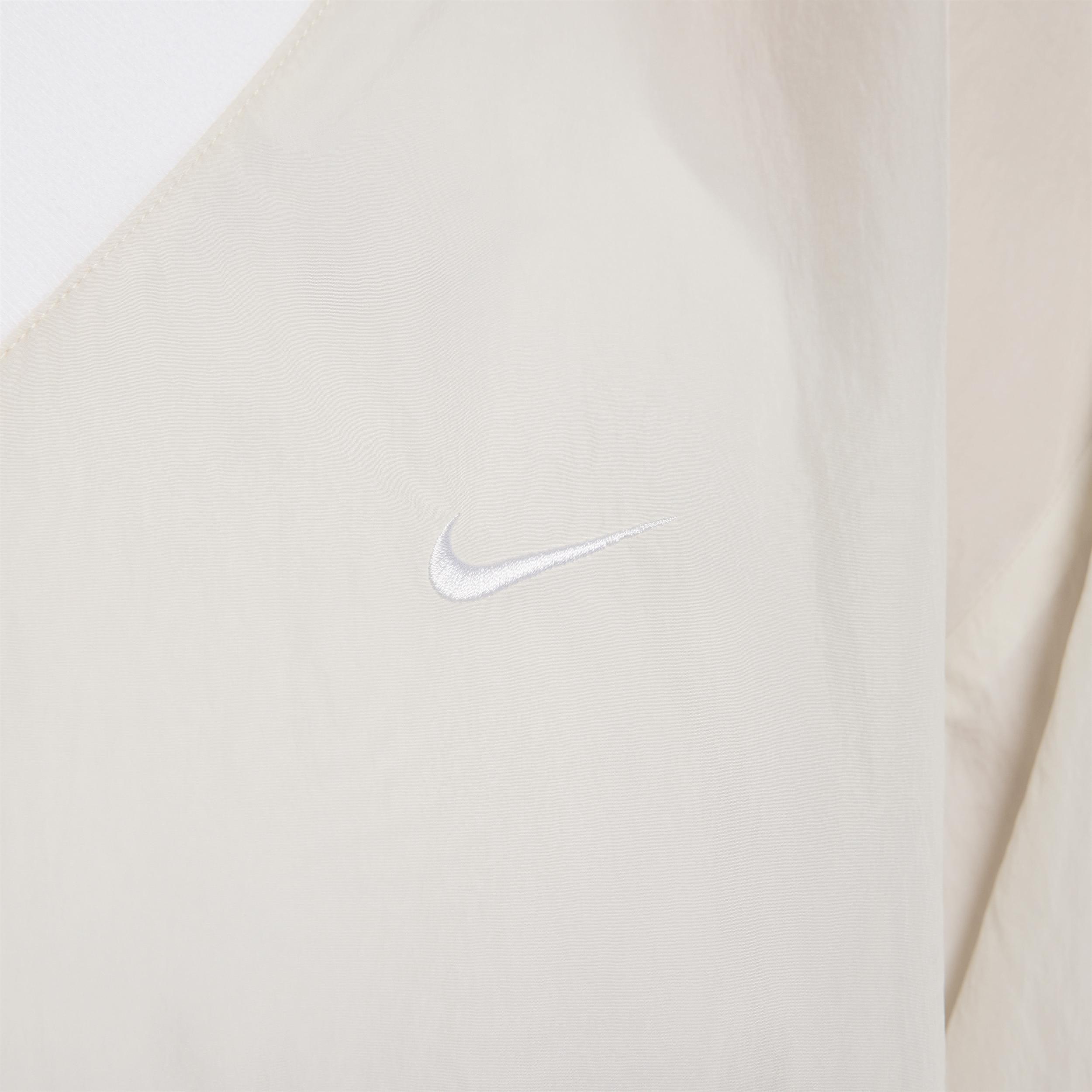 Womens Nike Sportswear Essential Loose UV Woven Long-Sleeve V-Neck Top Product Image