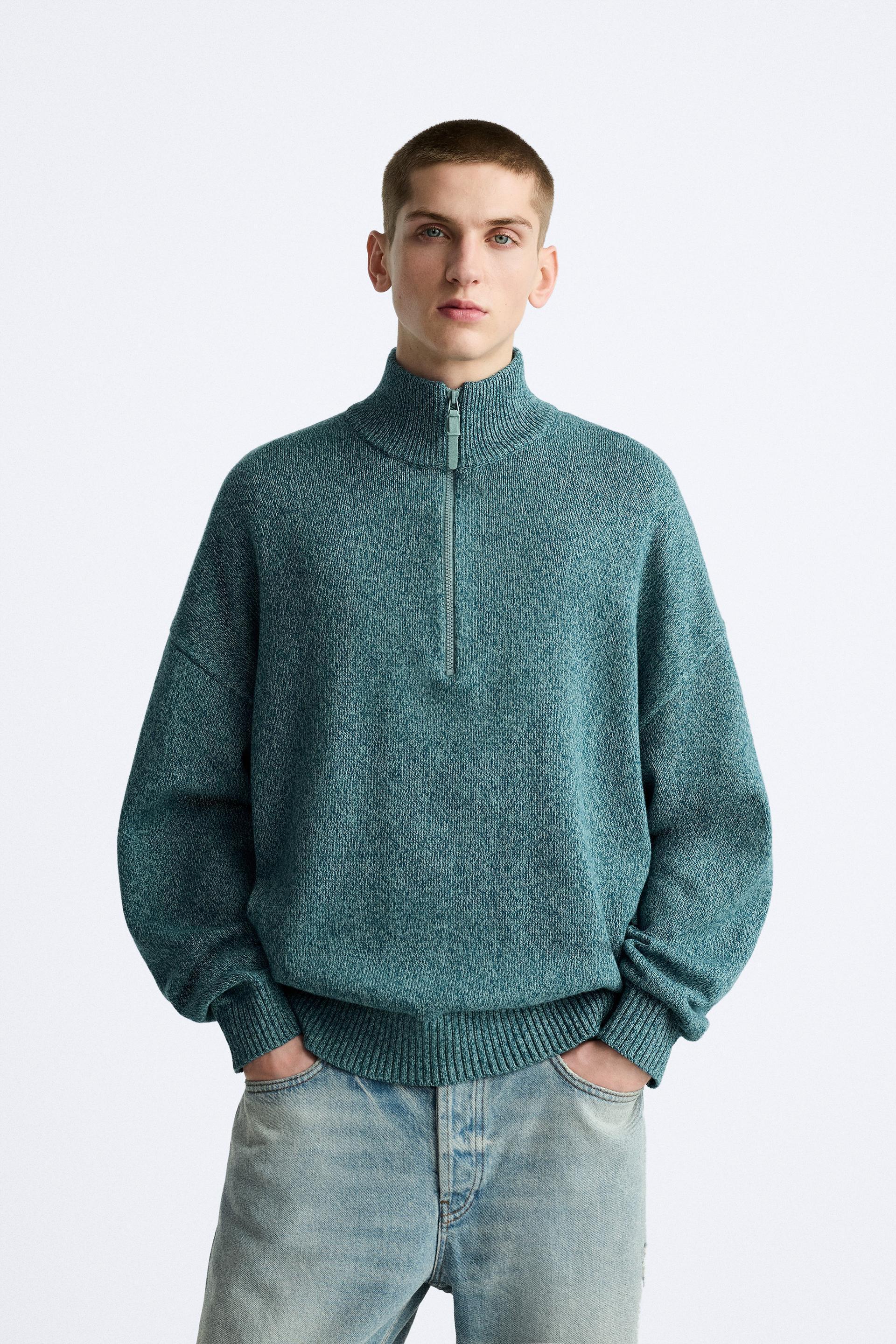 Mock neck sweater with front zip closure. Long sleeves. Rib trim. Product Image