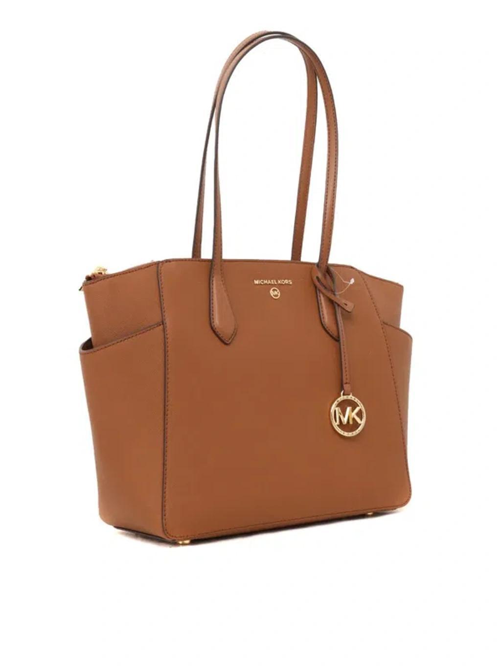 MICHAEL KORS Hand Held Bag. In Brown Product Image