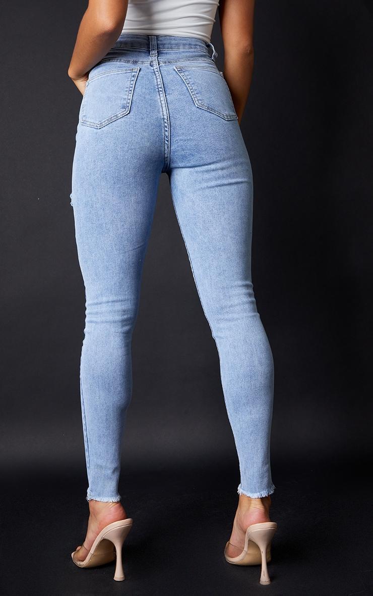 PRETTYLITTLETHING Petite Vintage Wash Thigh Rip Raw Hem 5 Pocket Skinny Jeans Product Image