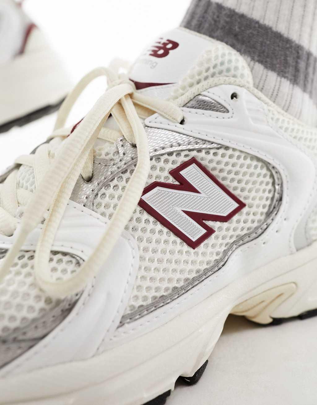 New Balance 530 sneakers in white with burgundy and silver details Product Image