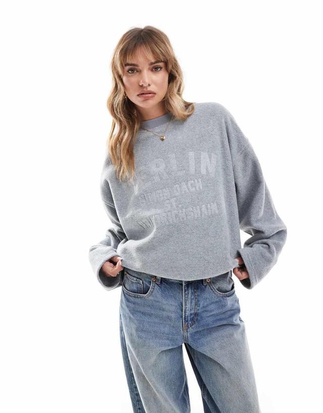 ASOS DESIGN embossed berlin graphic borg sweatshirt in gray heather Product Image