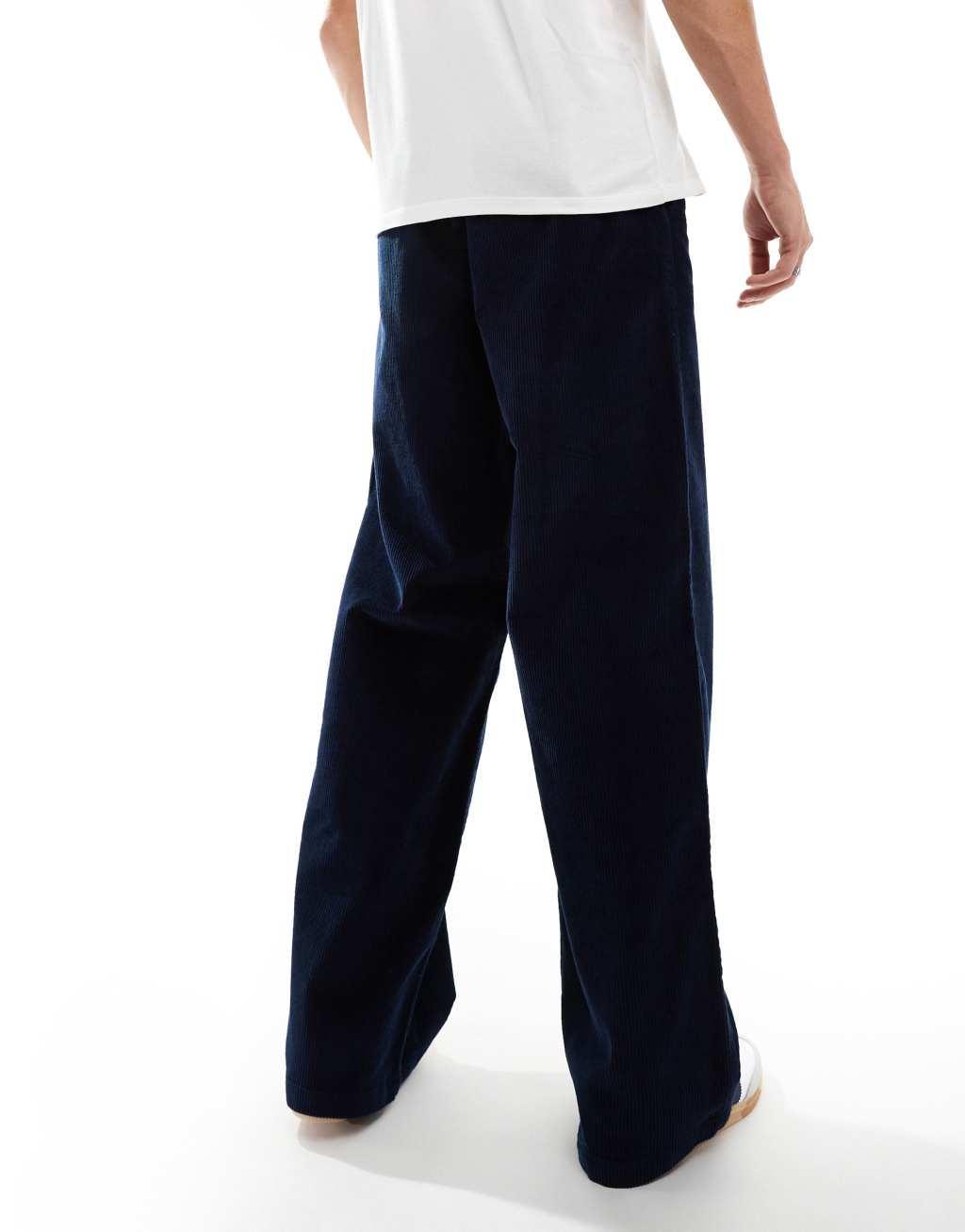 ASOS DESIGN super baggy fit corduroy pants in navy Product Image