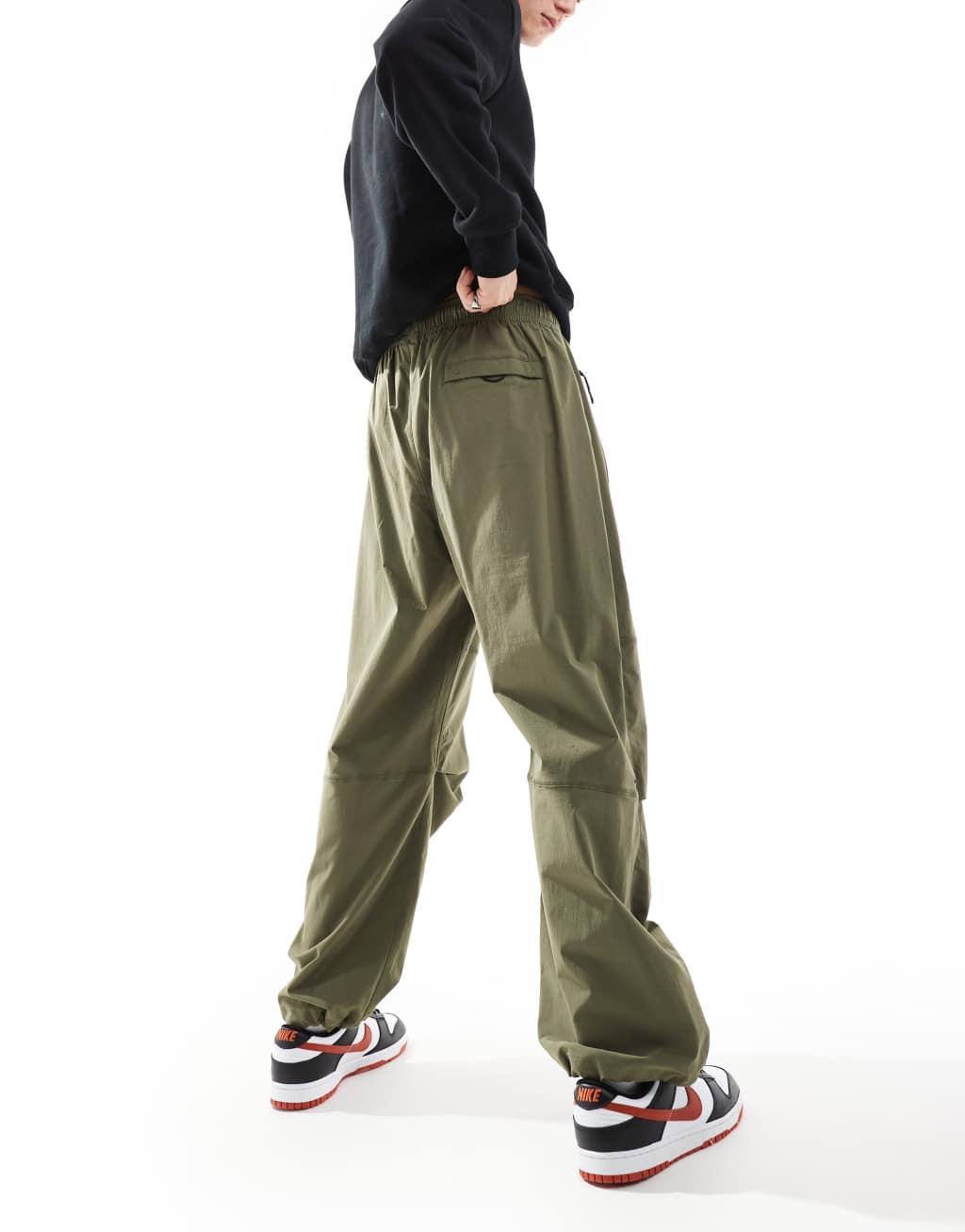 Nike Tech Woven oversized pants in khaki Product Image