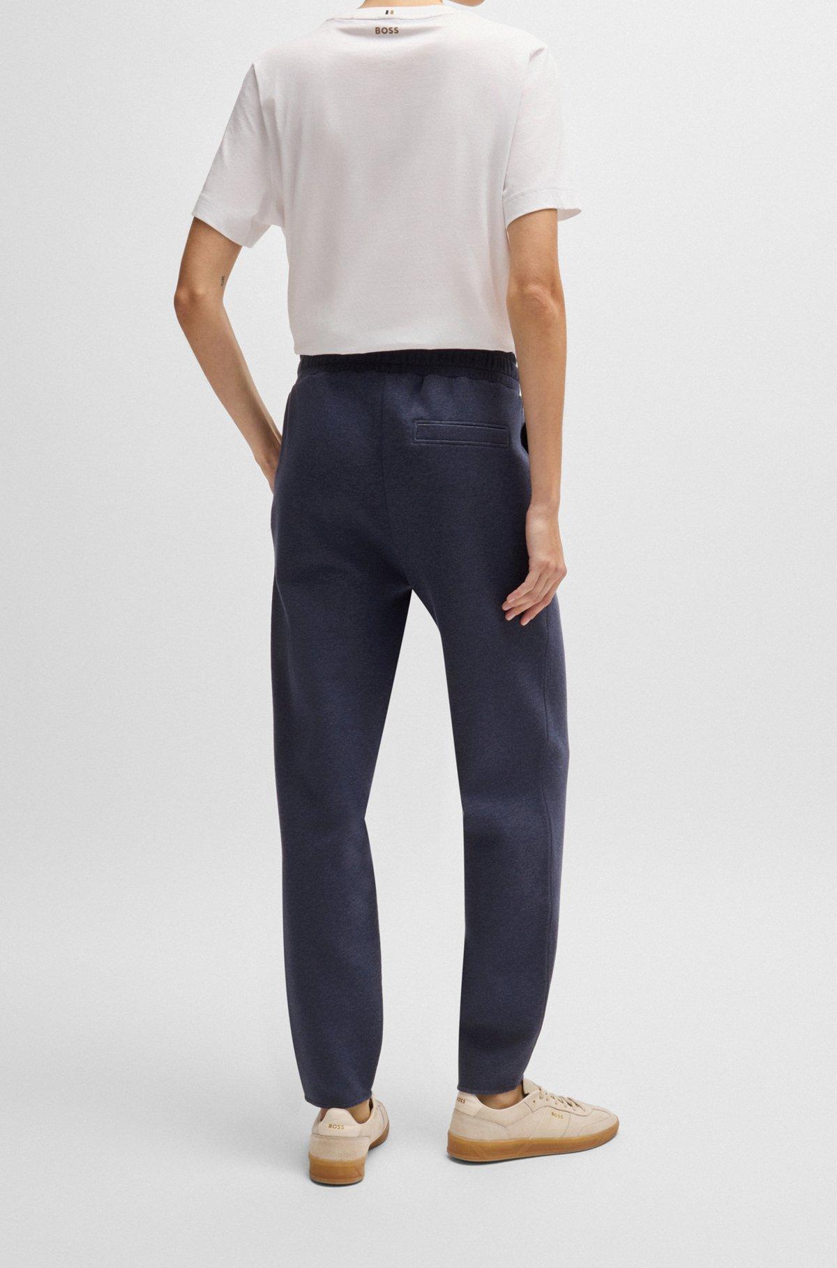 Cuffed tracksuit bottoms in melange cotton Product Image