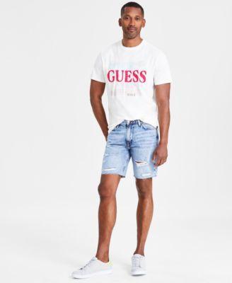 Guess Mens World Stamps Regular Fit Logo Graphic T Shirt Wyatt Slim Fit Destroyed Cutoff 9 Denim Shorts Product Image