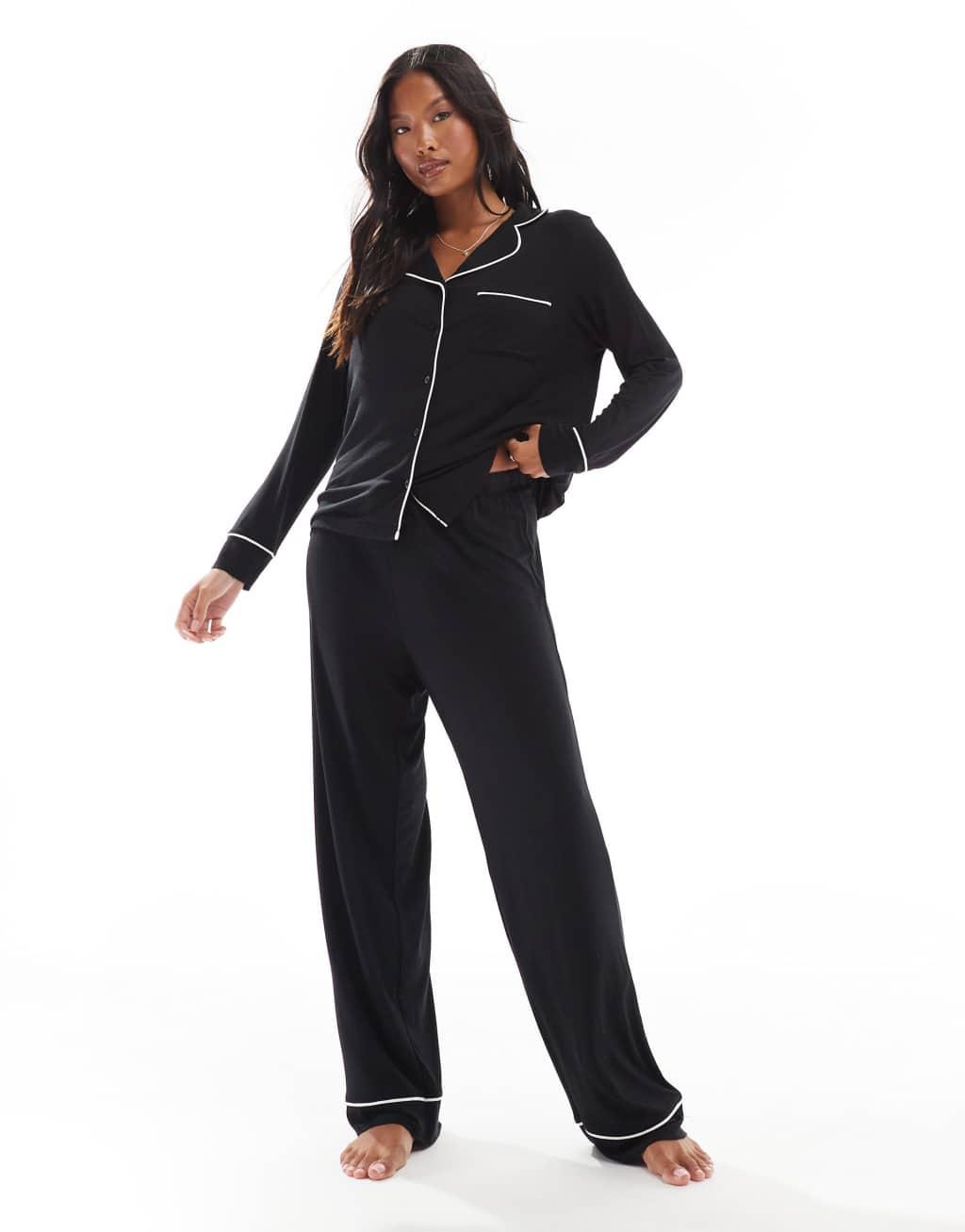 ASOS DESIGN Petite super soft long sleeve shirt & pants pajama set with contrast piping in black Product Image