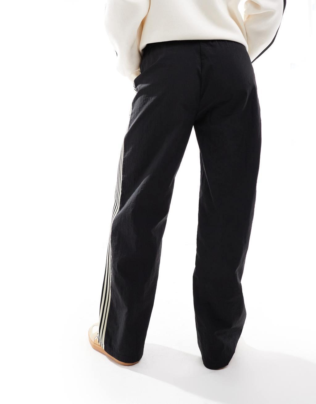 Pull&Bear side stripe wide leg nylon sweatpants in black Product Image