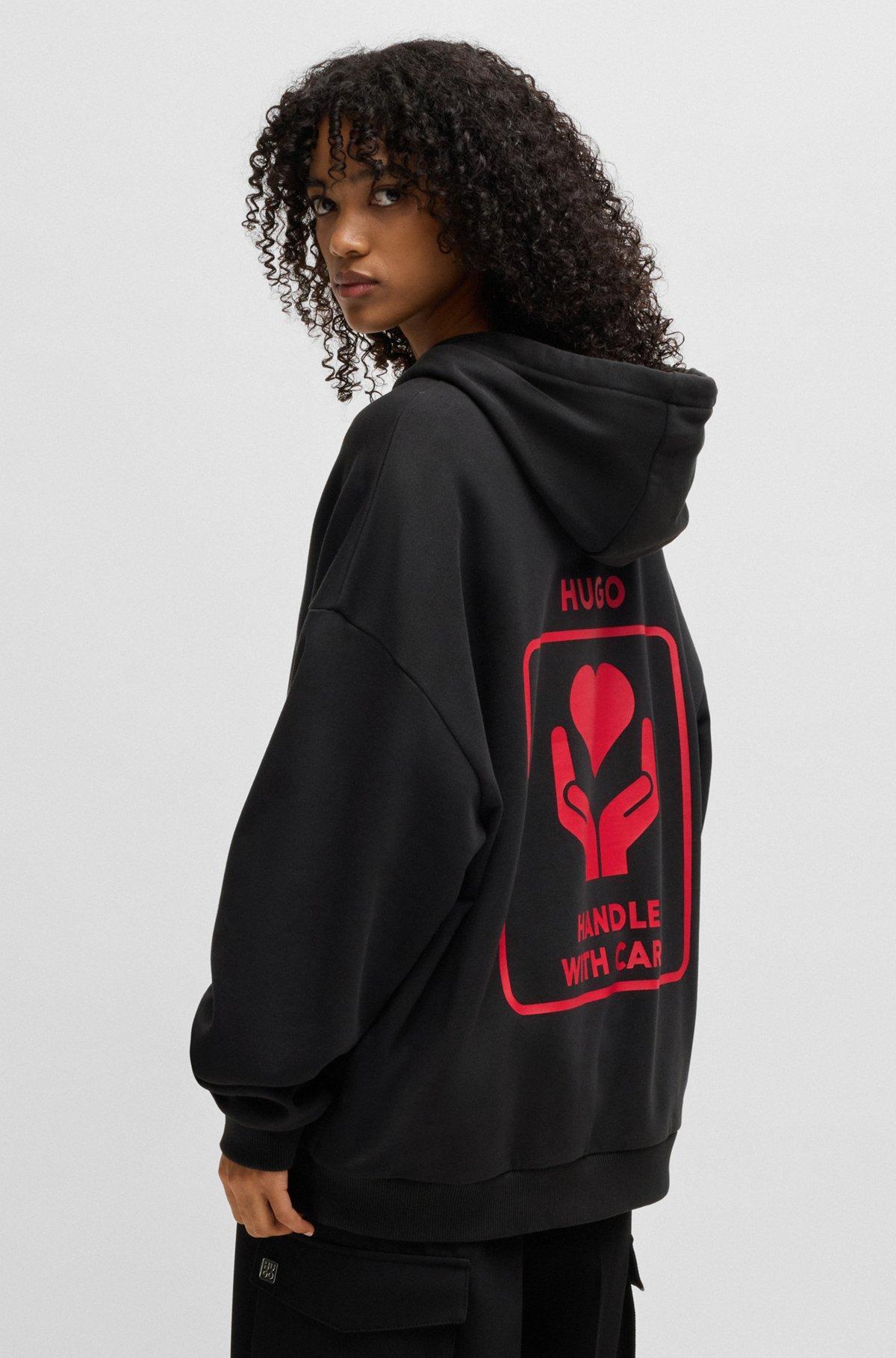 Cotton-terry hoodie with slogan and heart graphics Product Image