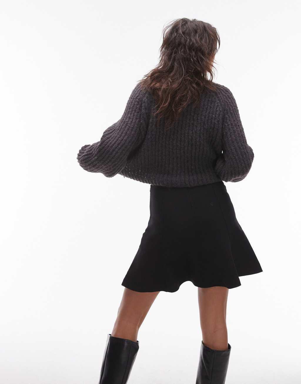 ARKET sculptural flippy mini skirt in black Product Image