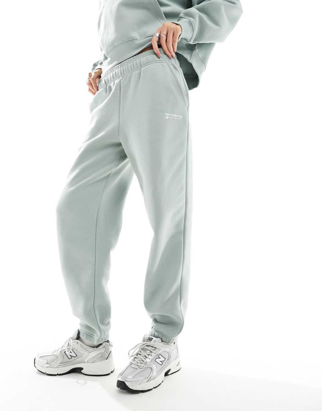 New Balance Linear Heritage brushed back track pants in light green Product Image