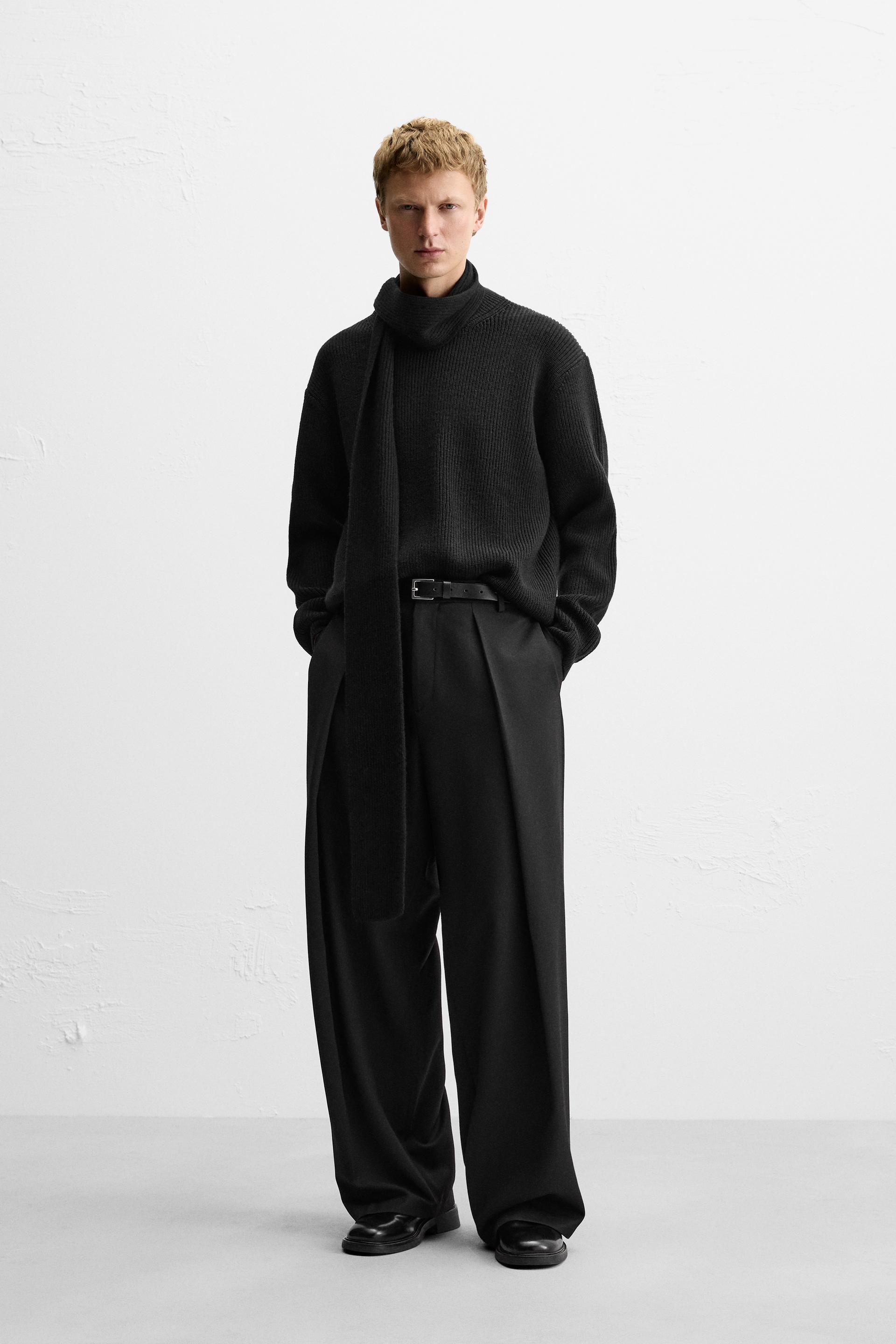 Wide fit pants. Front pleats at waist. Side pockets and back welt pockets. Front zip and hidden metal hook closure. product image