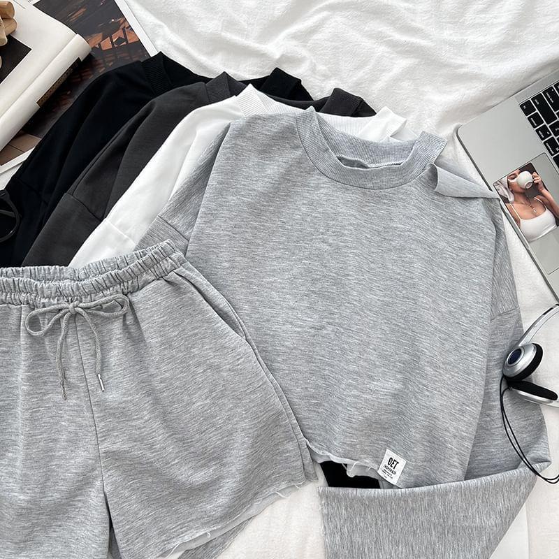 Set: Long-Sleeve Crew Neck Plain Crop T-Shirt + Drawstring Plain Shorts Product Image