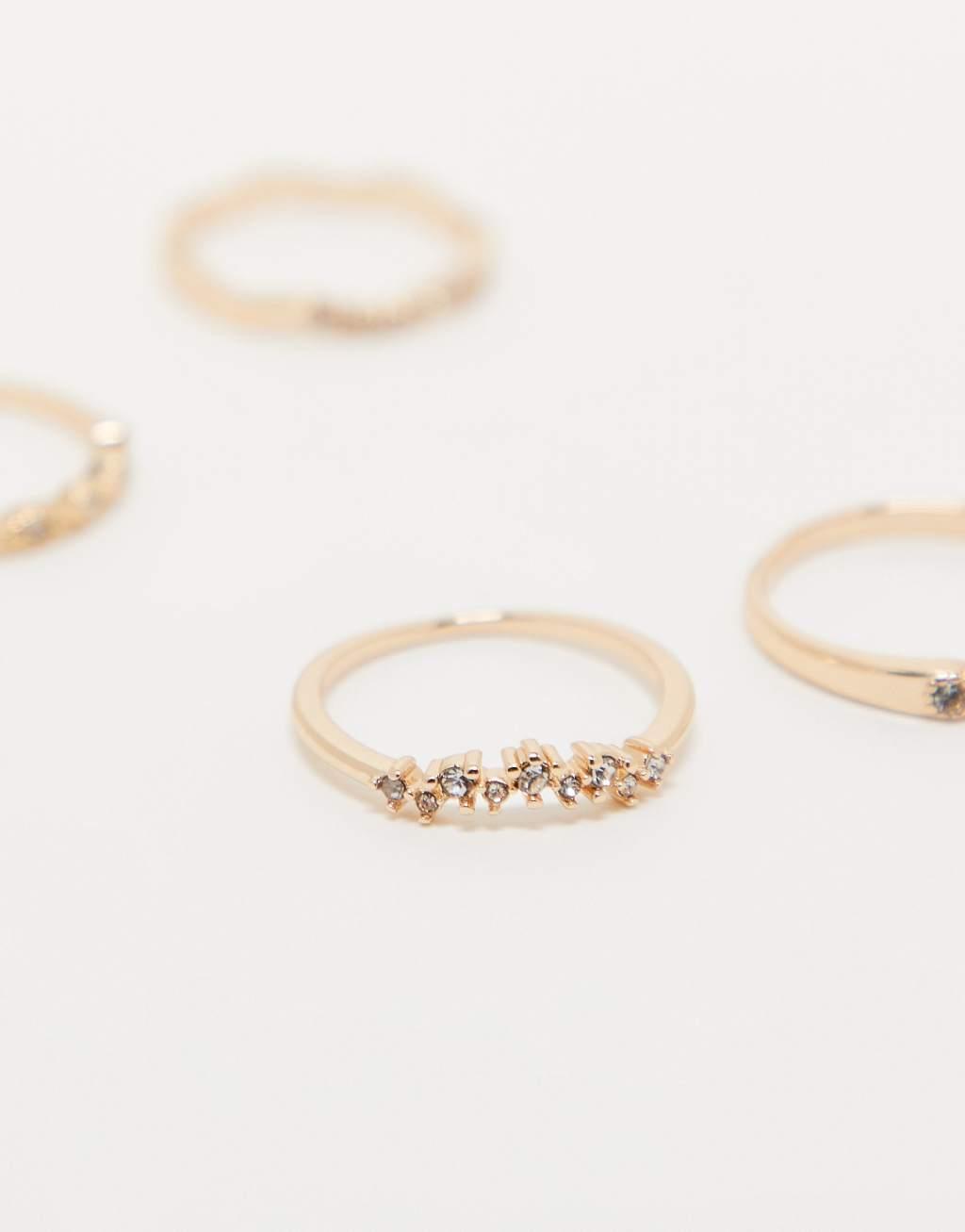 ASOS DESIGN pack of 4 rings with delicate crystal detail in gold tone Product Image