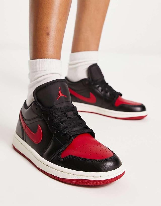 Nike Jordan Air 1 Low sneakers in black and red Product Image