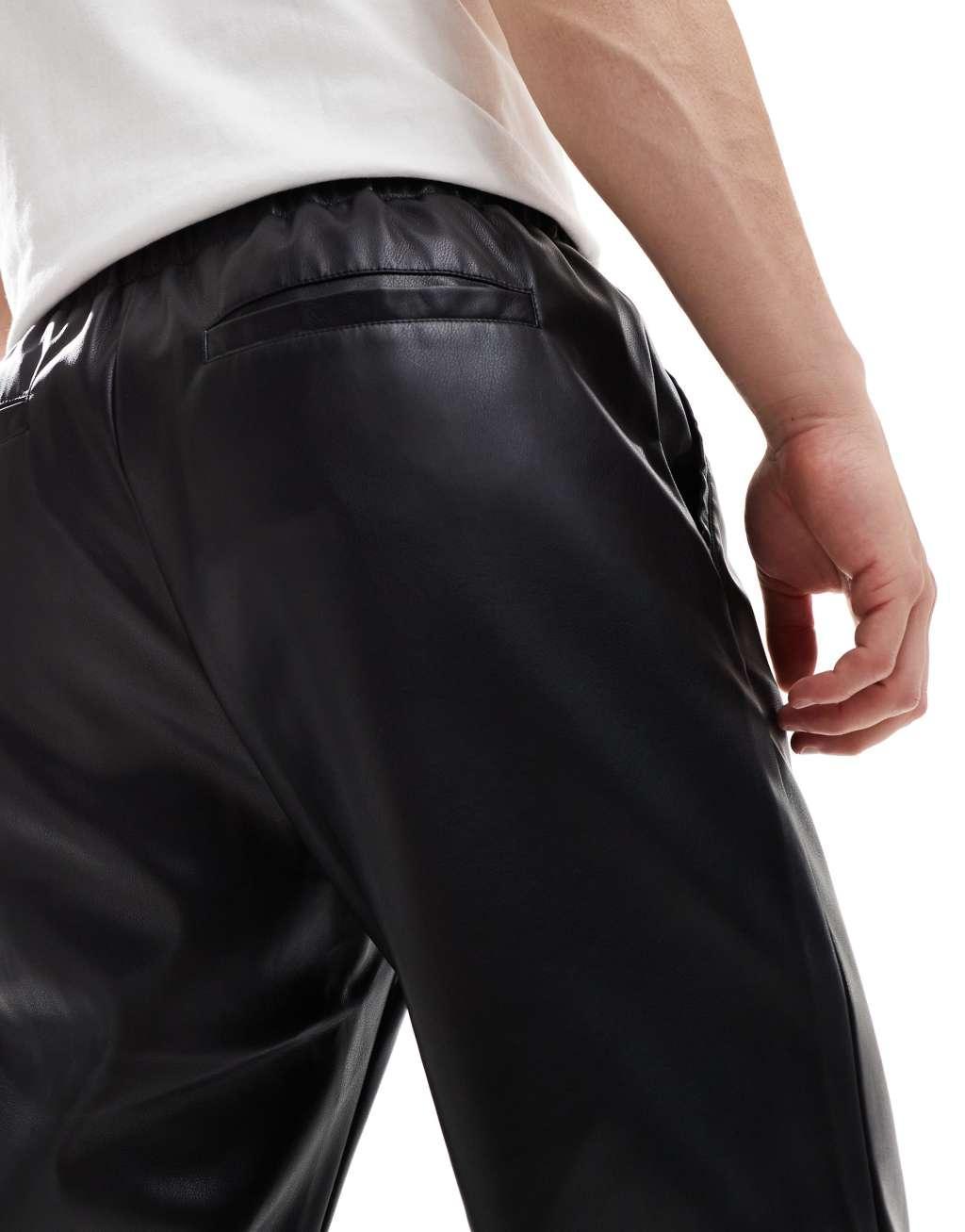 ASOS DESIGN leather look tapered pants in black Product Image