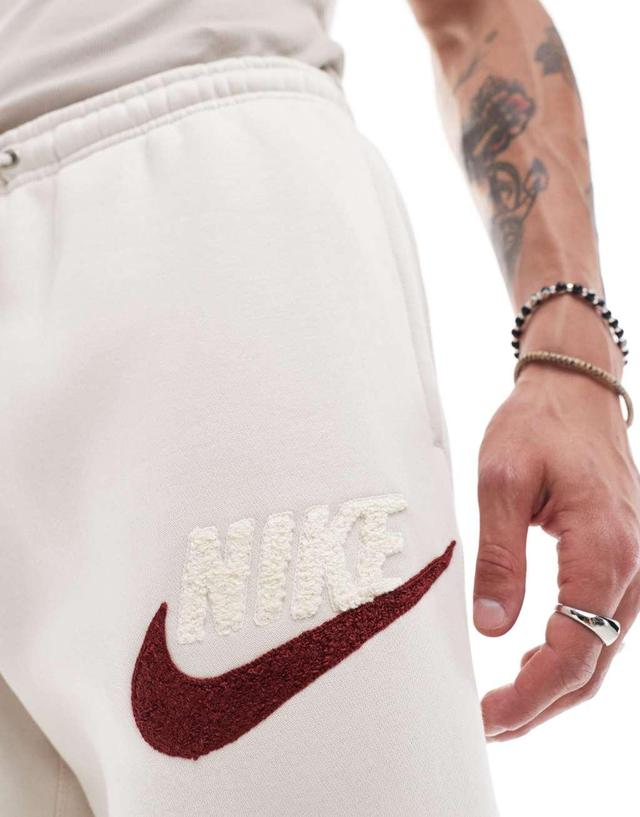 Nike Club Chenile Futura logo joggers in beige Product Image