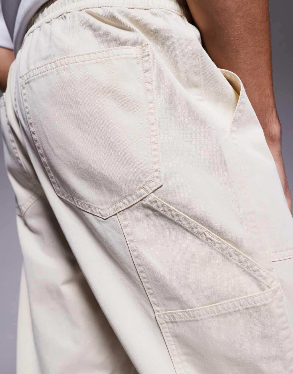 ASOS DESIGN pull on pants with carpenter detailing in beige Product Image