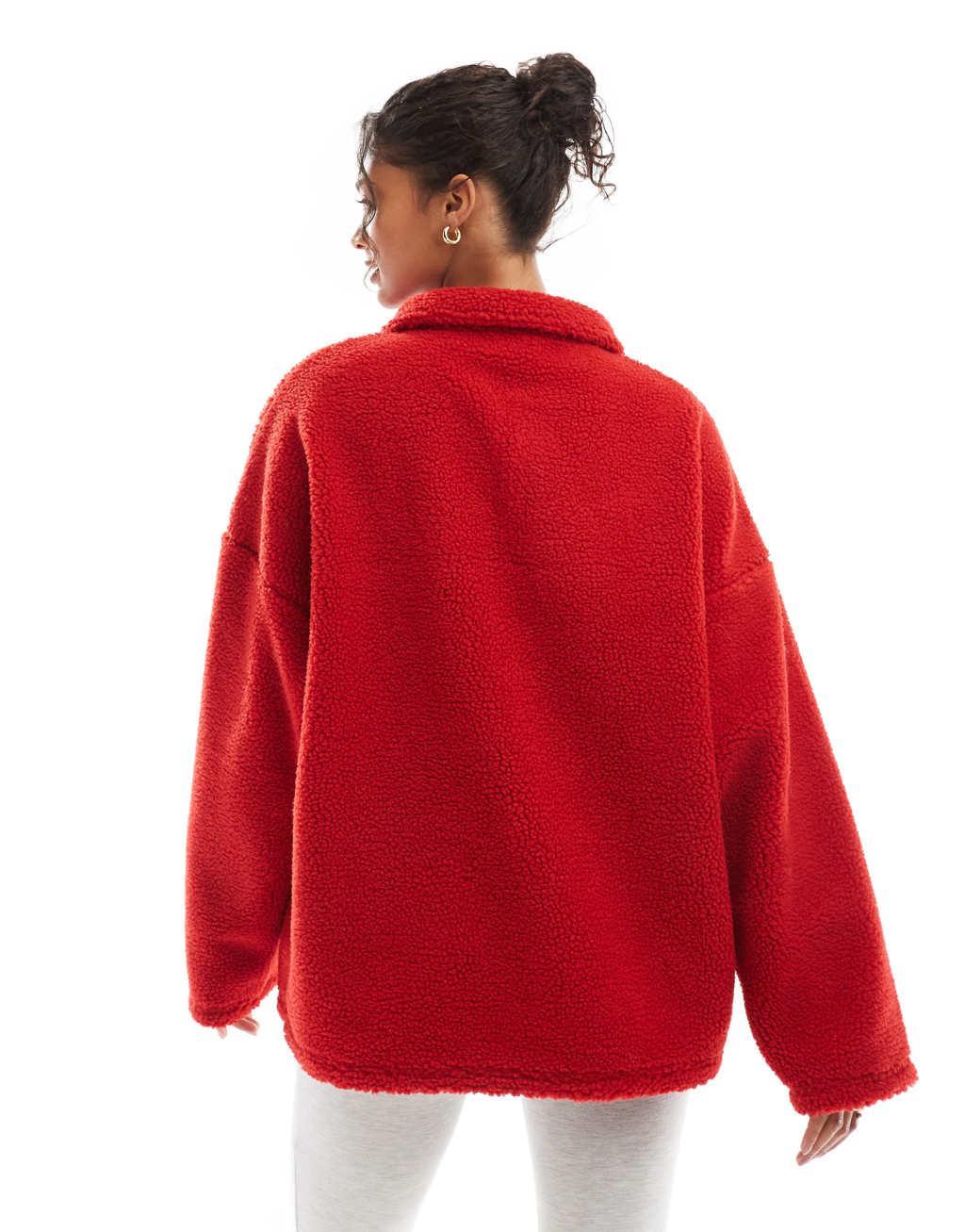 ASOS DESIGN apres ski borg graphic sweatshirt in red Product Image