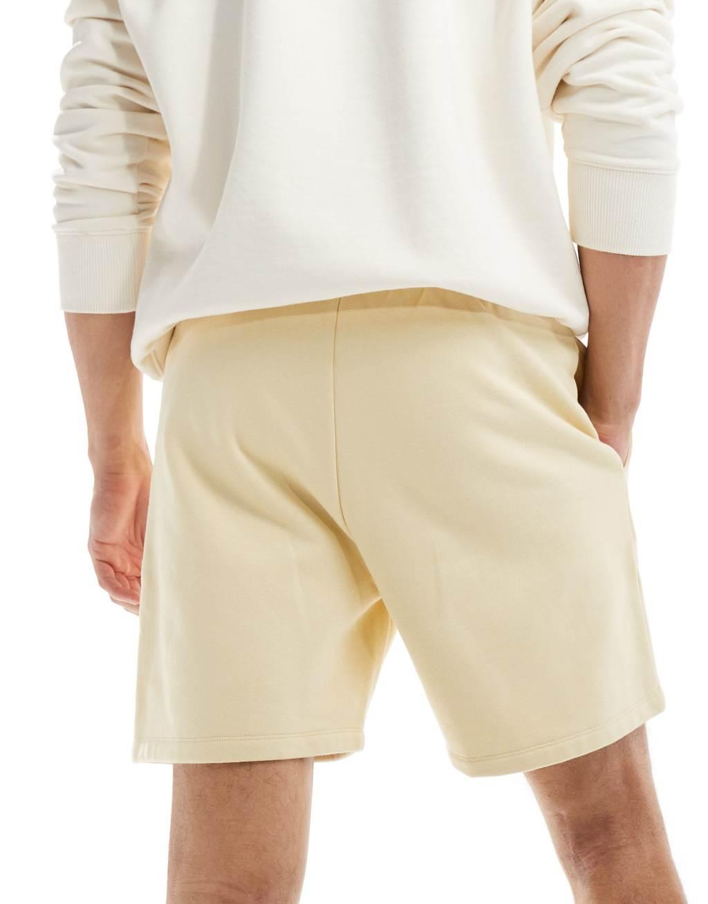 ASOS DESIGN premium heavyweight oversized shorts in yellow Product Image