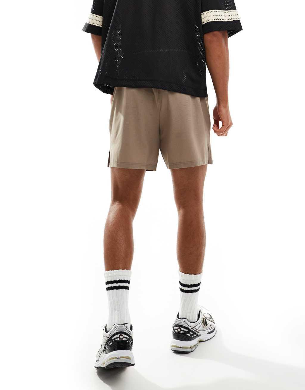 ASOS 4505 ripstop running shorts with zip side pockets in taupe gray Product Image