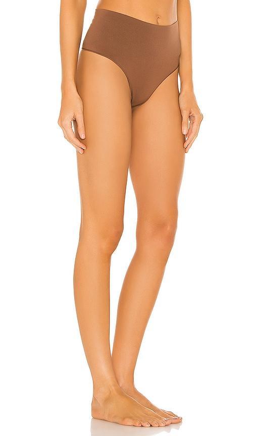 SPANX Everyday Shaping Thong in Brown. Product Image