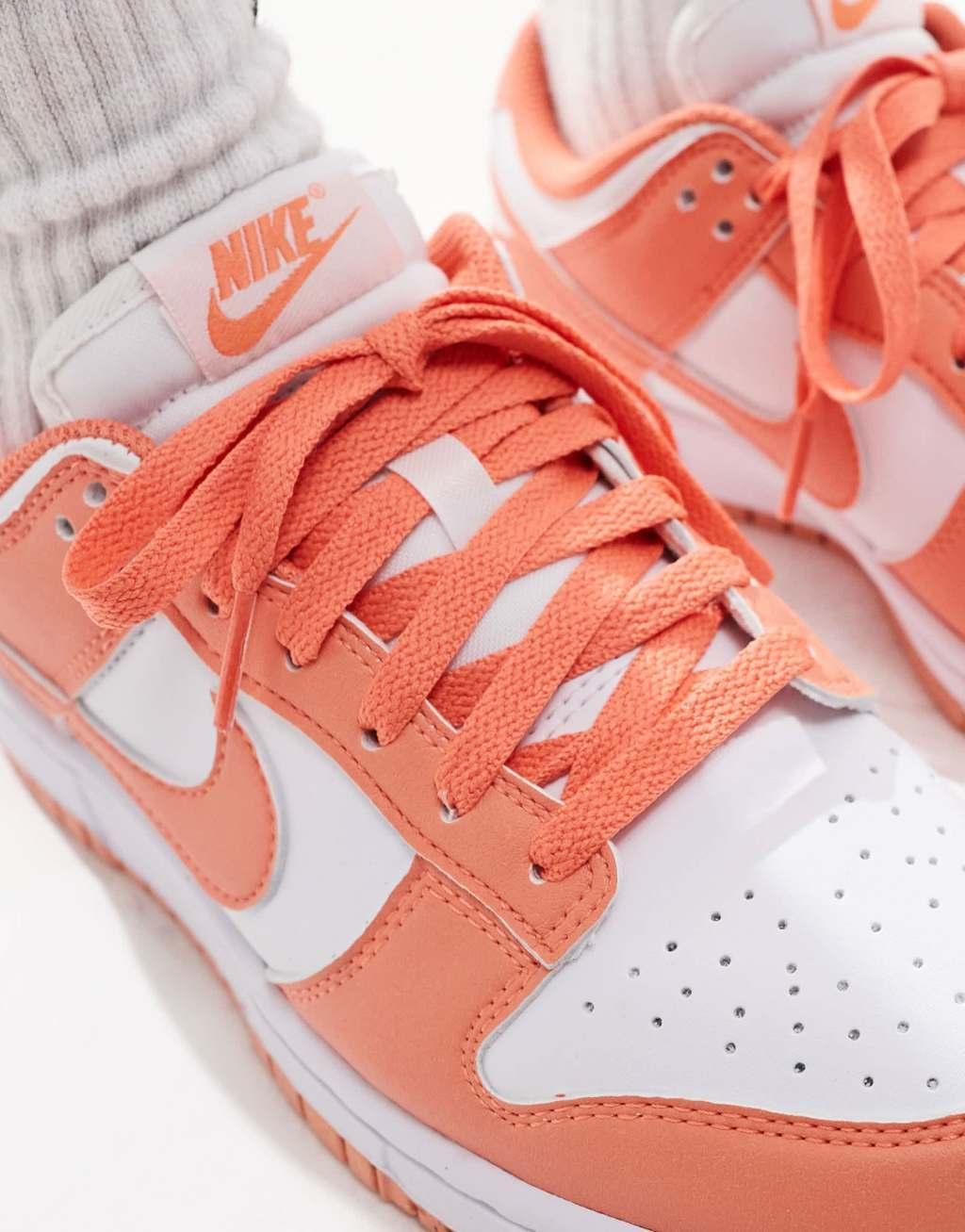 Nike Dunk Low sneakers in white and orange Product Image