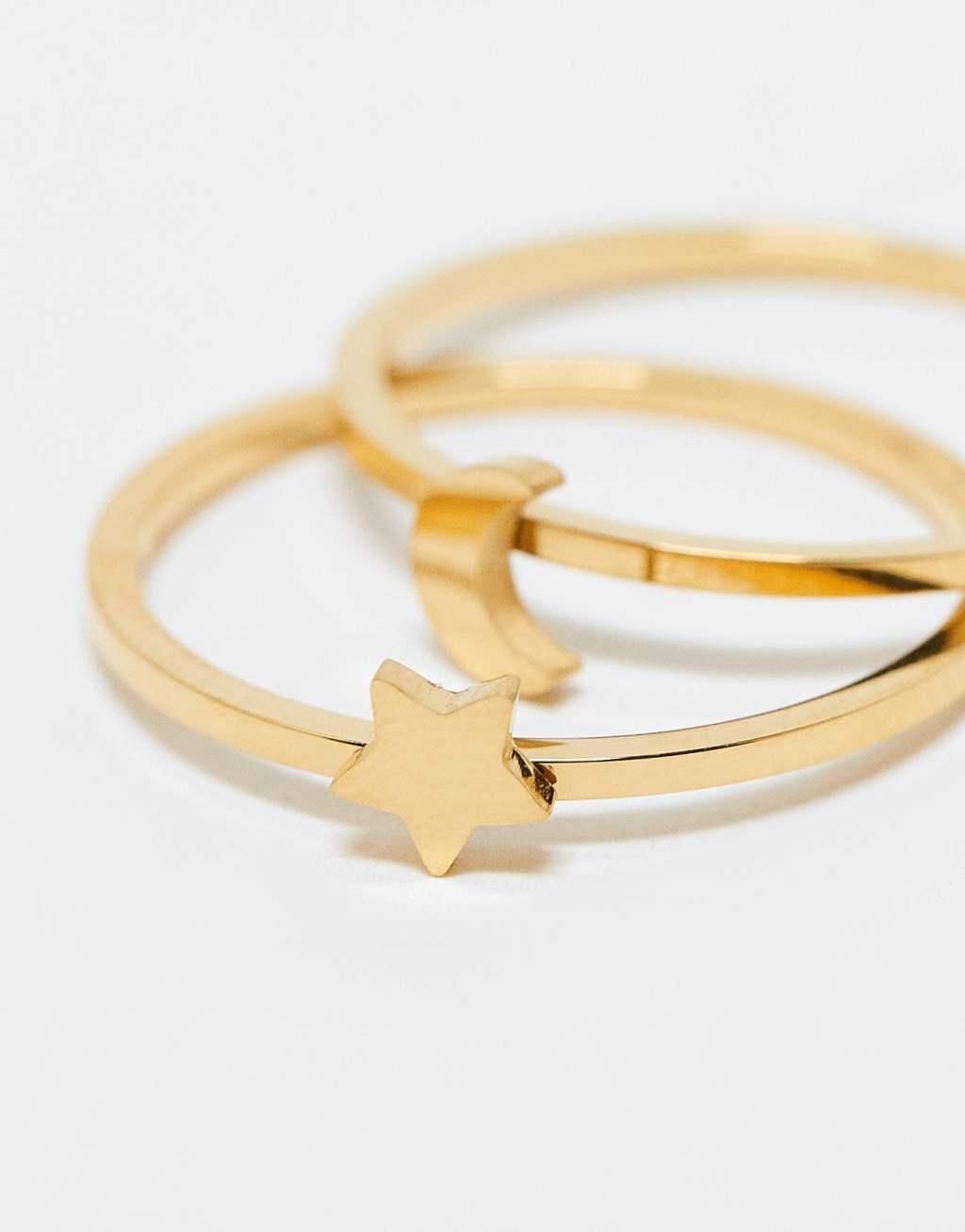 ASOS DESIGN waterproof stainless steel pack of 2 rings with star and moon in gold tone with gift bag Product Image