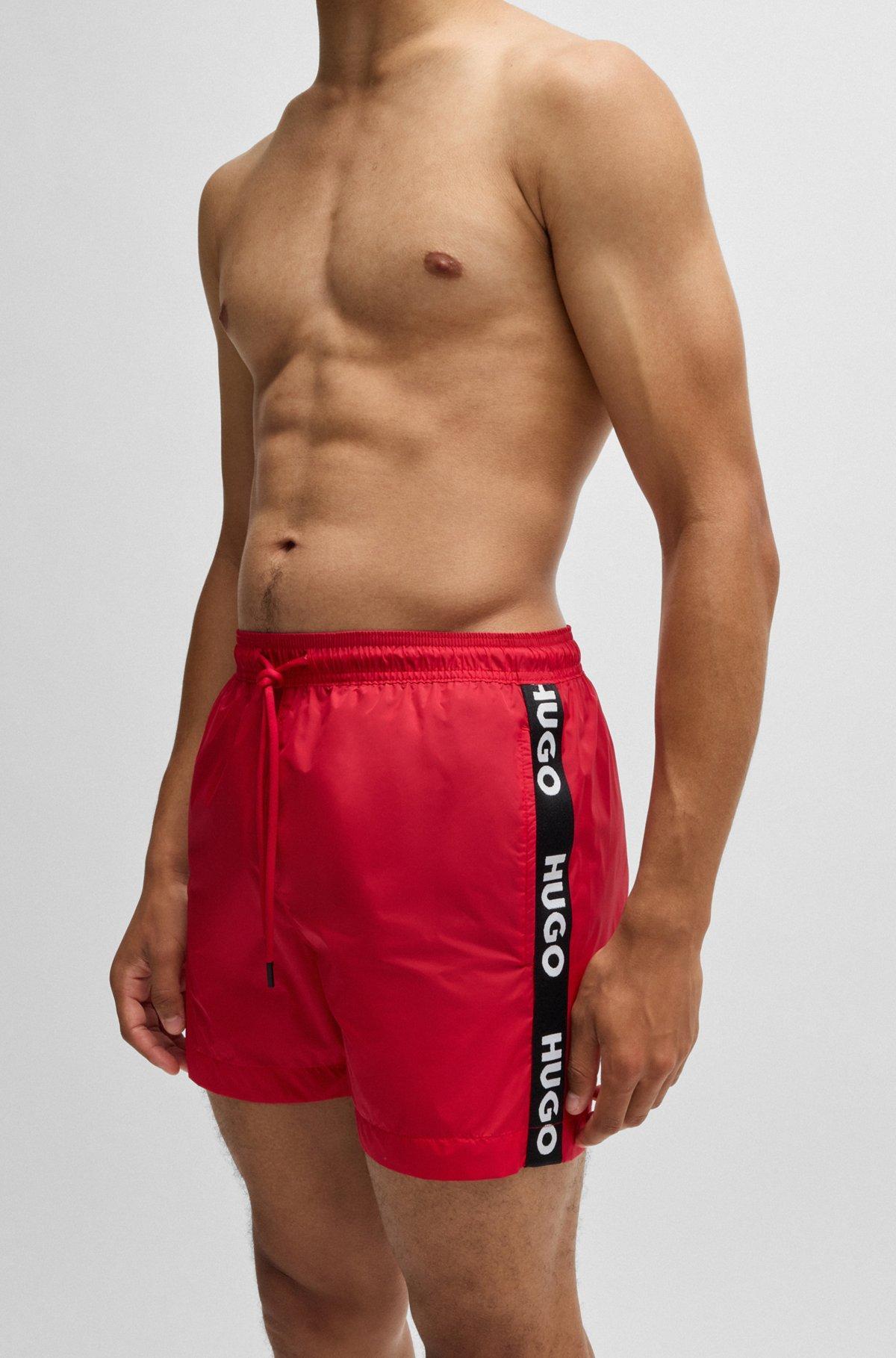 Fully lined swim shorts with logo tape Product Image