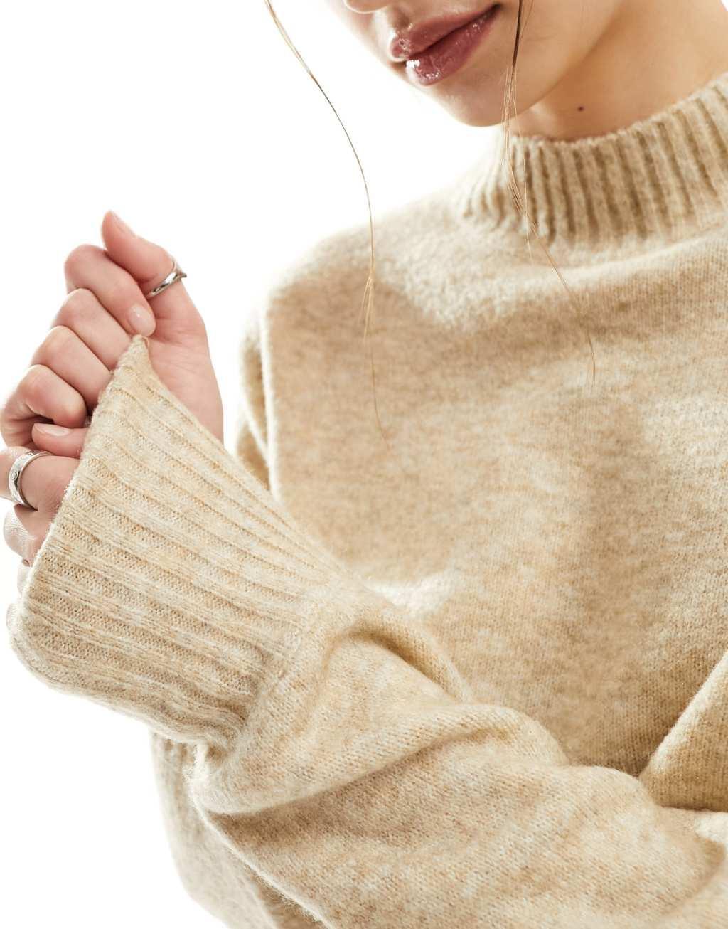 Monki knitted turtleneck sweater in beige Product Image