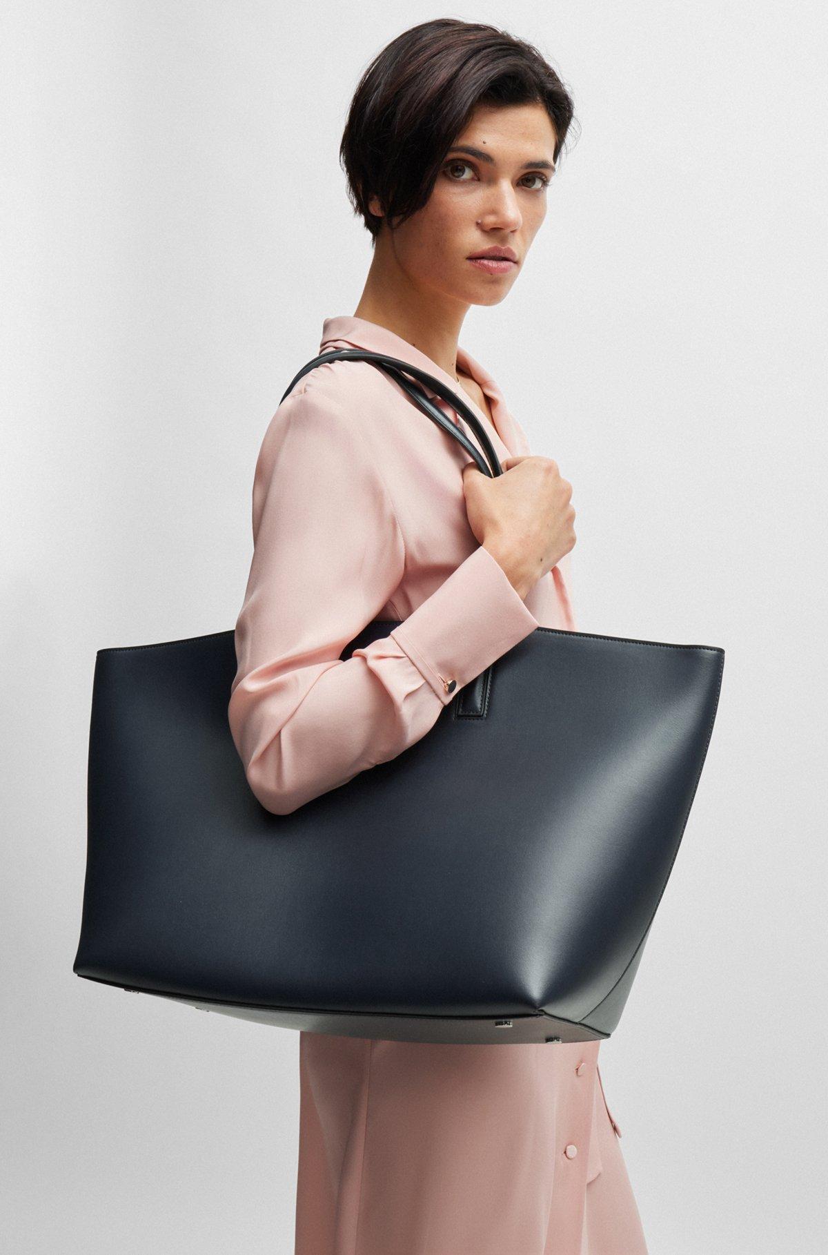 Leather shopper bag with signature hardware Product Image