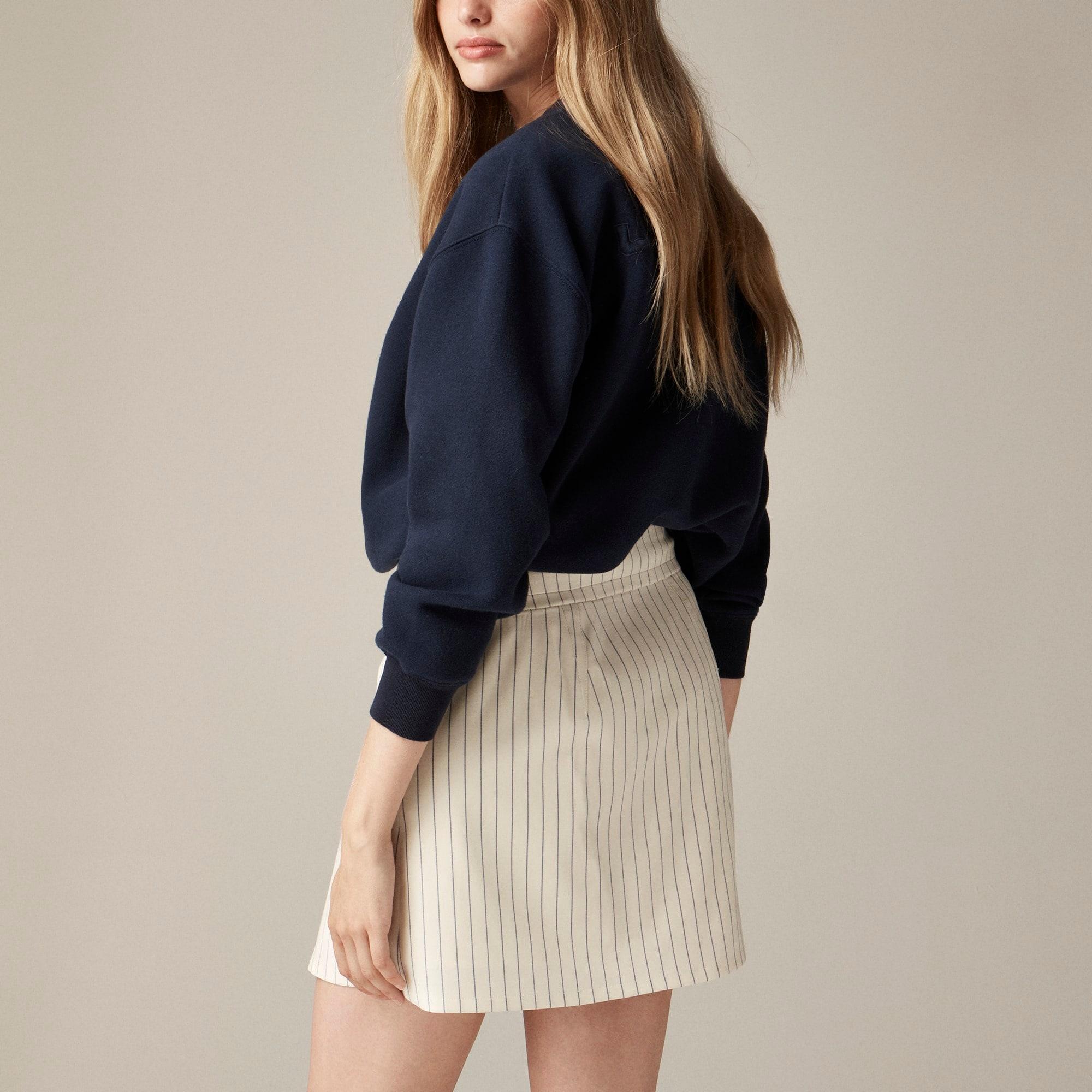 Center-pleat mini skirt in ivory pinstripe Italian wool blend Product Image